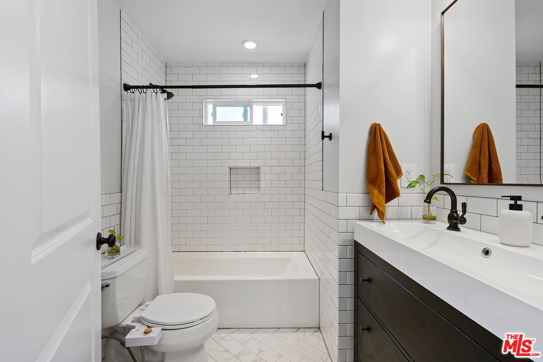 8000 Ramsgate Avenue Los Angeles, CA 90045 - Photo 11 of 23 a bathroom with a sink toilet and shower