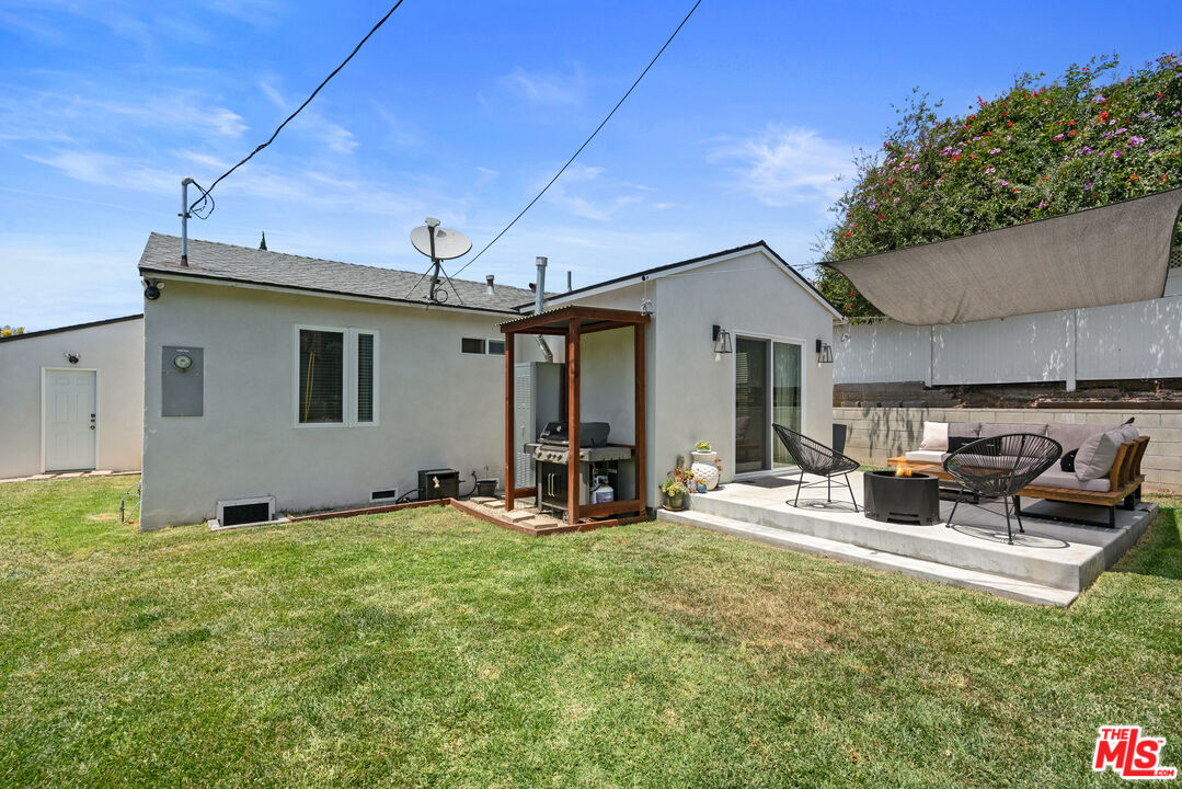 8000 Ramsgate Avenue Los Angeles, CA 90045 - Photo 16 of 23 a view of a house with backyard sitting area and porch