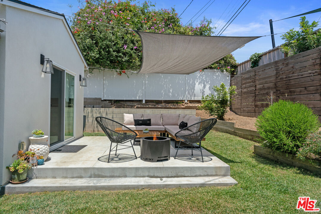 8000 Ramsgate Avenue Los Angeles, CA 90045 - Photo 17 of 23 a view of backyard with table and chairs and potted plants
