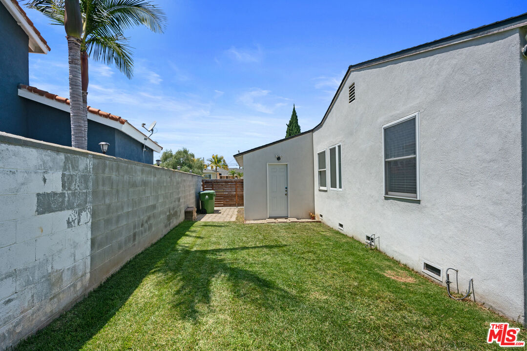 8000 Ramsgate Avenue Los Angeles, CA 90045 - Photo 23 of 23 a backyard of a house with palm tree