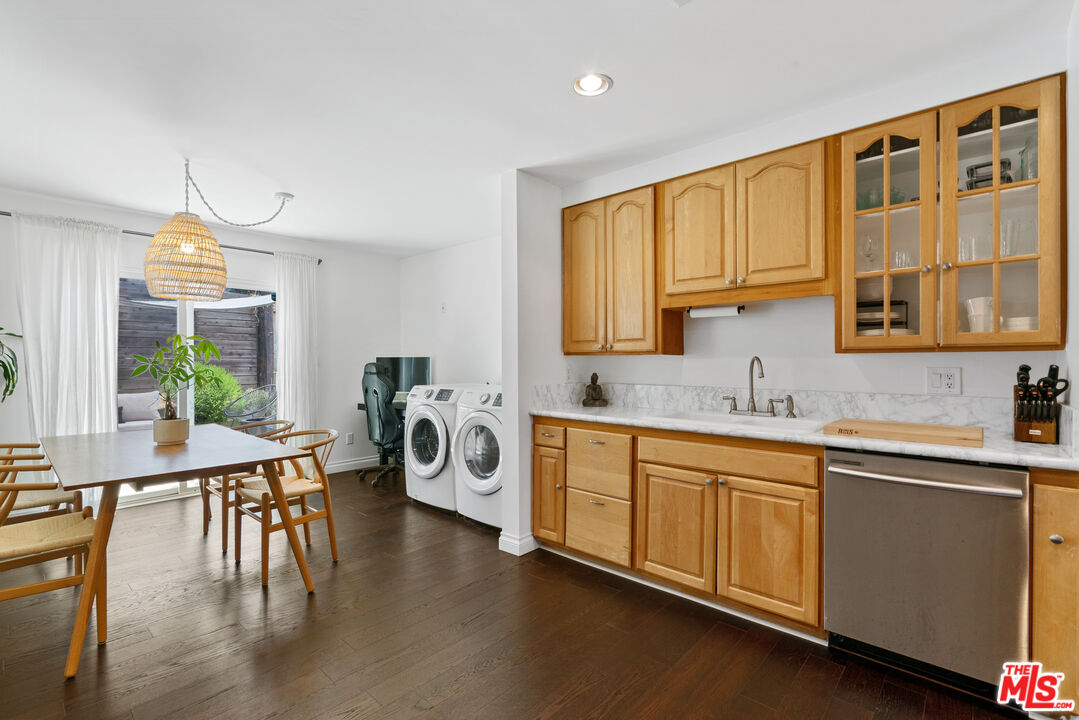 8000 Ramsgate Avenue Los Angeles, CA 90045 - Photo 4 of 23 a kitchen with a sink stove and cabinets