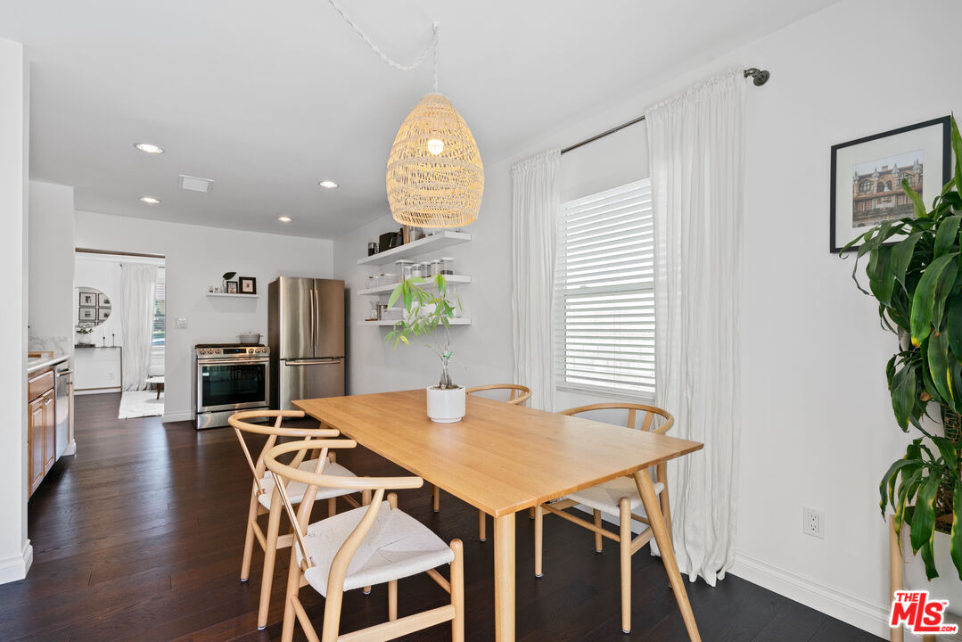 8000 Ramsgate Avenue Los Angeles, CA 90045 - Photo 6 of 23 a view of a dining room with furniture and wooden floor