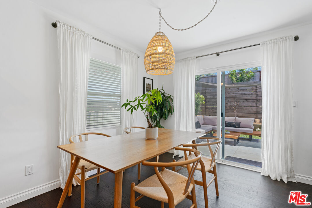 8000 Ramsgate Avenue Los Angeles, CA 90045 - Photo 7 of 23 a view of a dining room with furniture and wooden floor