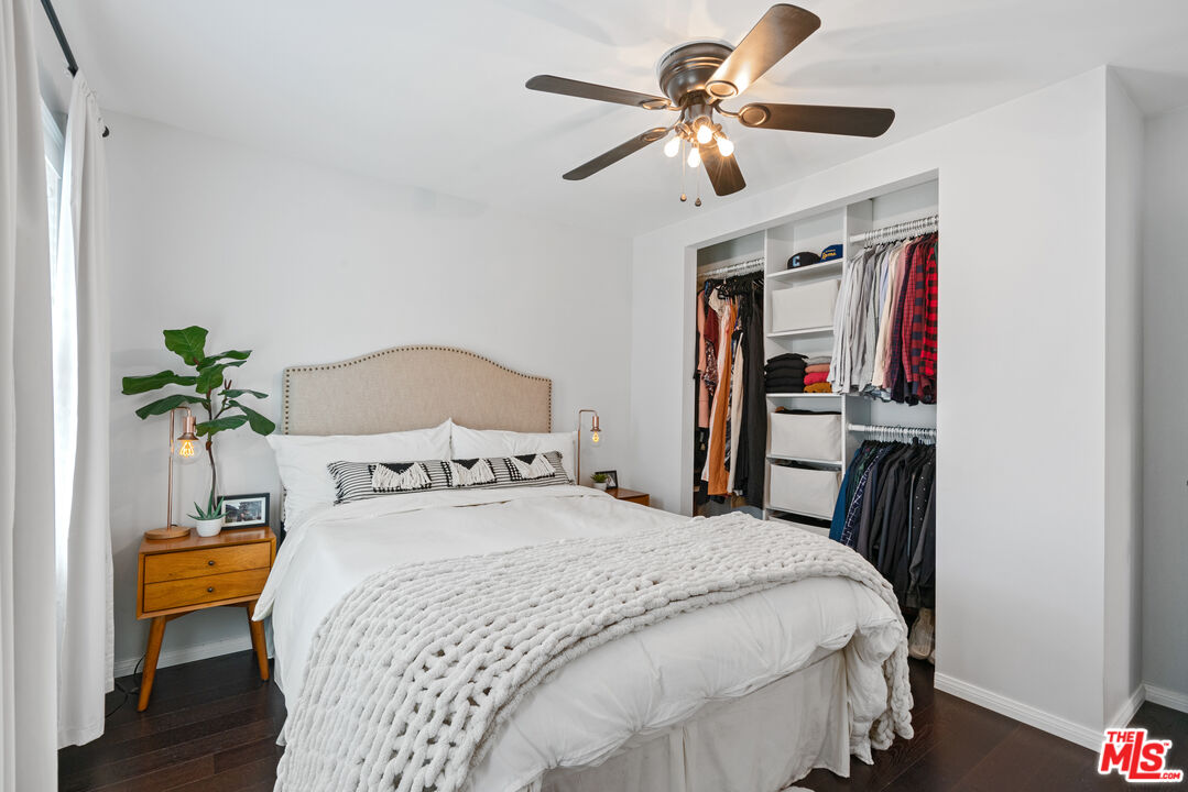 8000 Ramsgate Avenue Los Angeles, CA 90045 - Photo 8 of 23 a bedroom with a bed and a chandelier