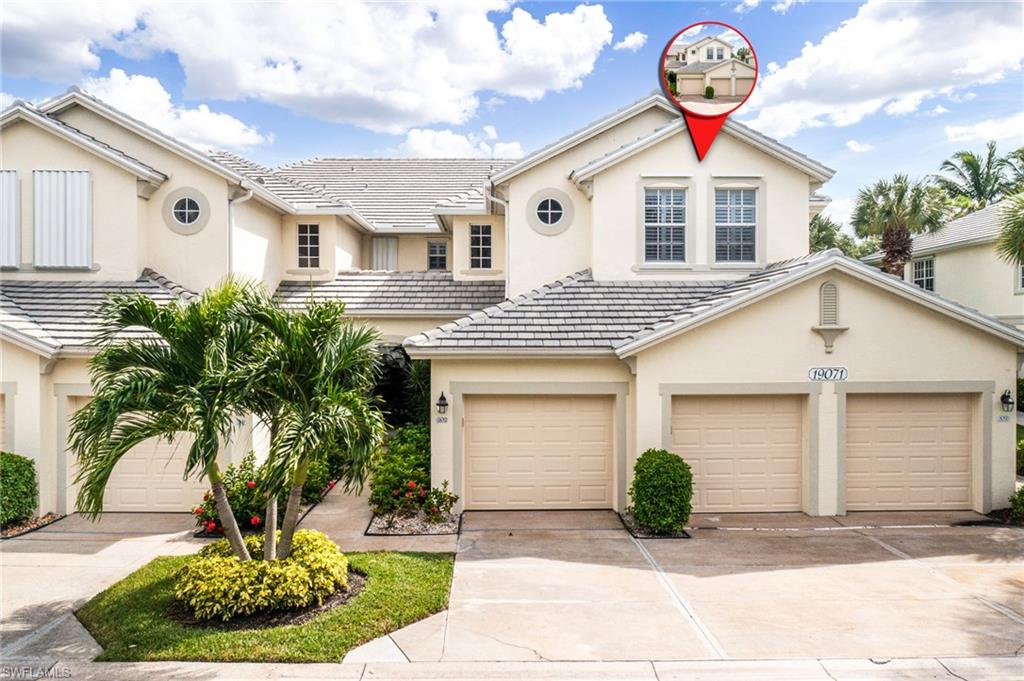 19071 Ridgepoint Drive, Unit 202 Estero, FL 33928 - Photo 1 of 26 a front view of a house with garden