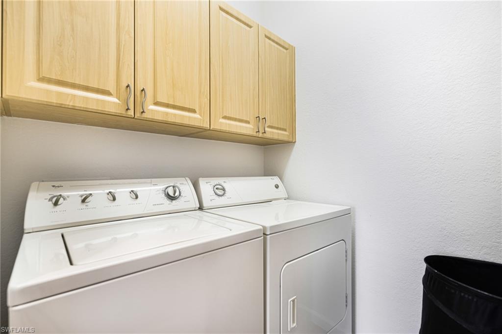 19071 Ridgepoint Drive, Unit 202 Estero, FL 33928 - Photo 11 of 26 a utility room with dryer and washer