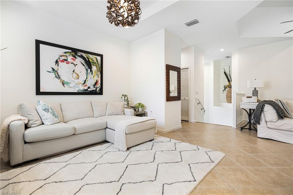 19071 Ridgepoint Drive, Unit 202 Estero, FL 33928 - Photo 4 of 26 a living room with furniture and a couch