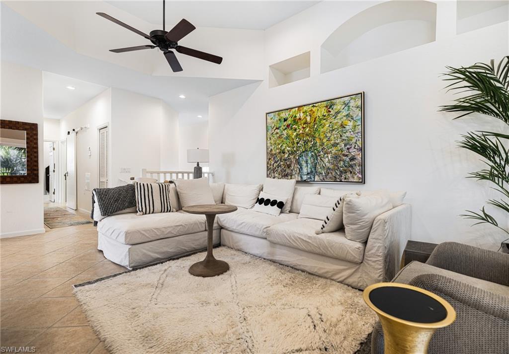 19071 Ridgepoint Drive, Unit 202 Estero, FL 33928 - Photo 5 of 26 a living room with furniture and a large window