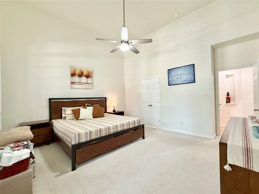 2754 Ridge View Road Frisco, TX 75034 - Photo 13 of 34 a bedroom with a bed and a painting on the wall