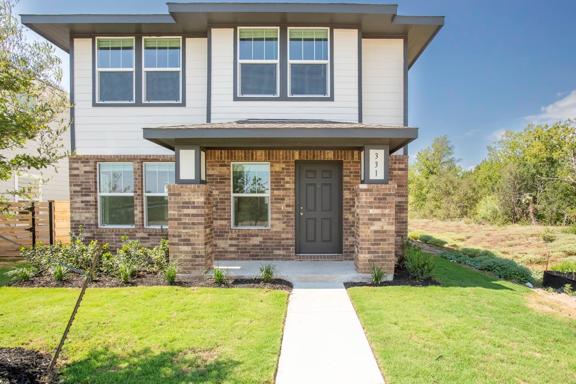 331 Bugbee Kyle, TX 78640 - Photo 2 of 22 a front view of a house with a yard