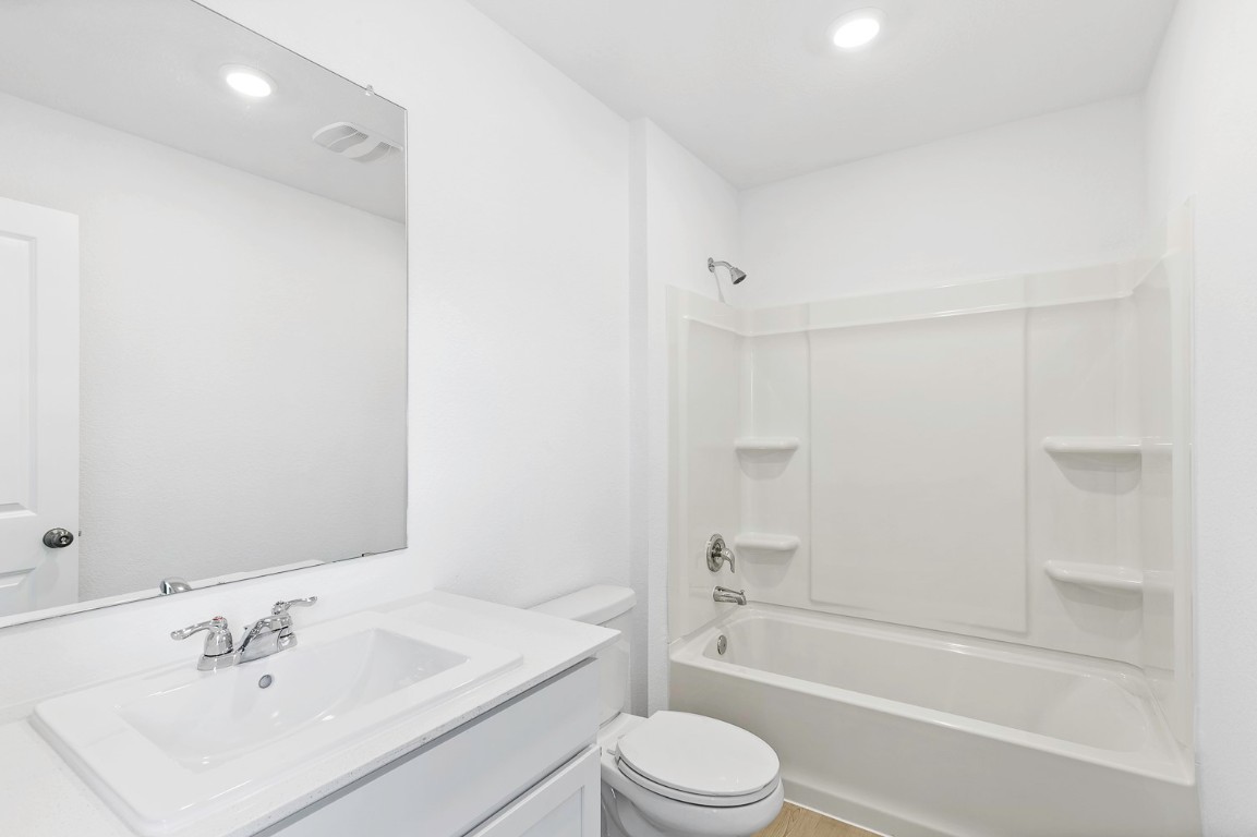 331 Bugbee Kyle, TX 78640 - Photo 9 of 22 a bathroom with a sink toilet and shower