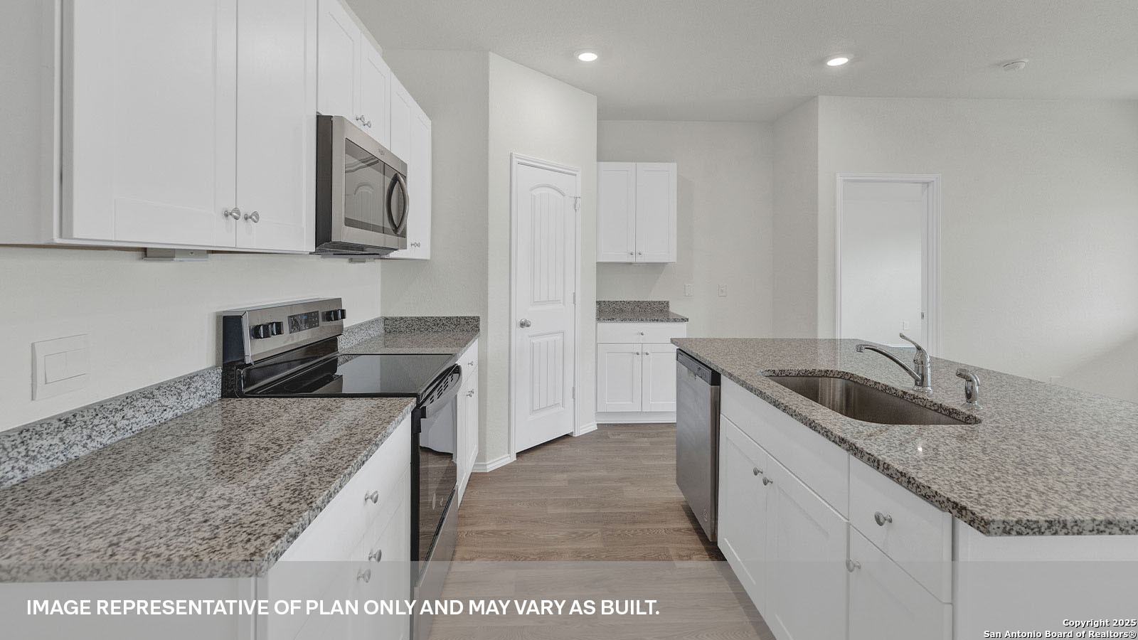 335 Boatman Cove Seguin, TX 78155 - Photo 12 of 38 a kitchen with granite countertop a sink a stove and cabinets