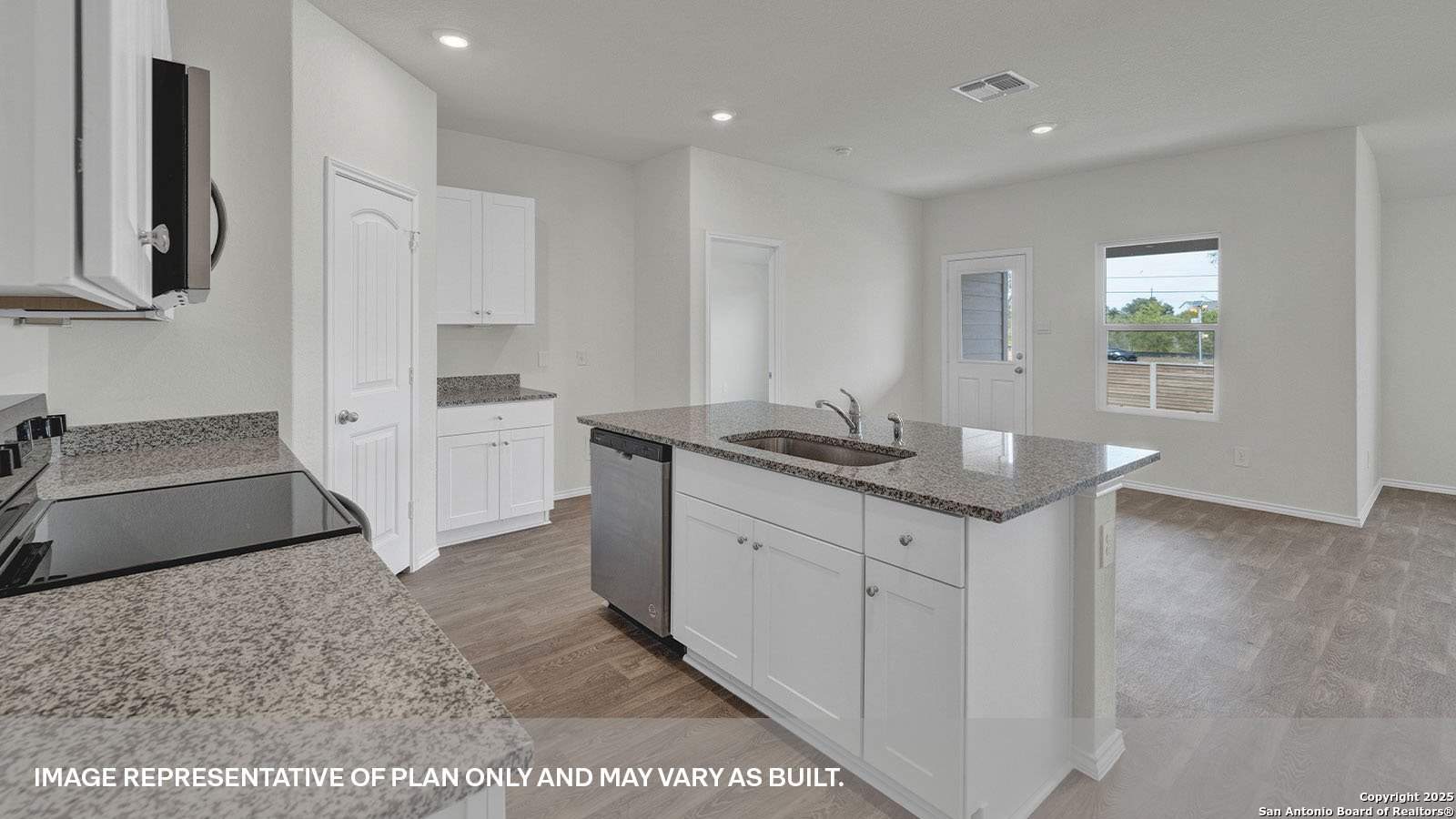 335 Boatman Cove Seguin, TX 78155 - Photo 13 of 38 a kitchen with stainless steel appliances granite countertop a sink and a stove