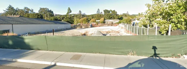 a view of a lake with a floor to ceiling window