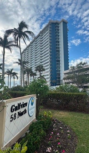 58 North Collier Boulevard, Unit 1103 Marco Island, FL 34145 - Photo 16 of 19 a front view of a house with garden