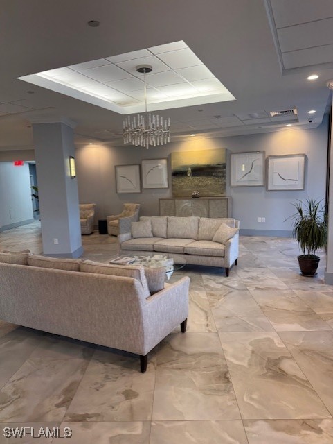 58 North Collier Boulevard, Unit 1103 Marco Island, FL 34145 - Photo 17 of 19 a living room with furniture and a chandelier