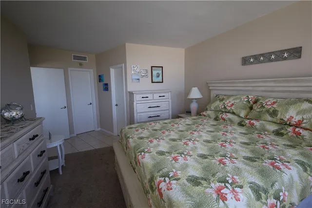 a bed room with a bed and a dresser