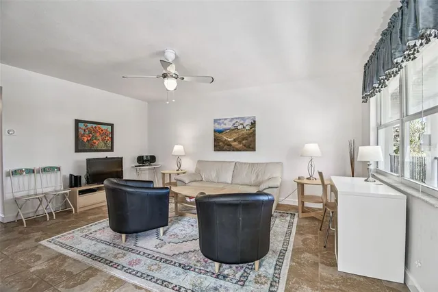 a living room with furniture and a window