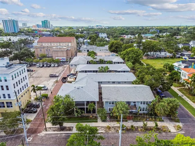 an aerial view of a house with roof deck
