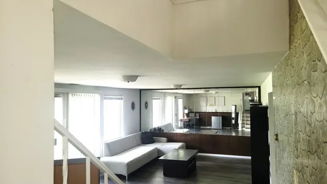 a living room with furniture and a table