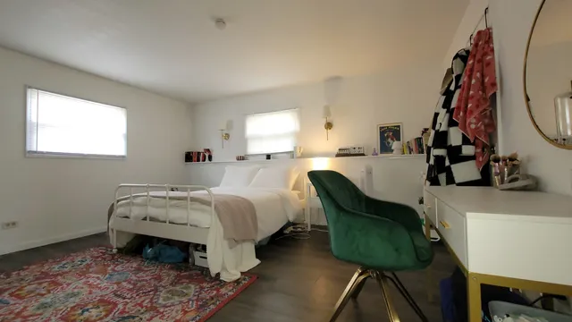 a bed room with furniture and a window