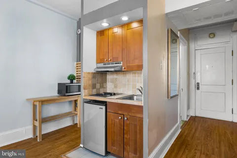 a view of a kitchen with a sink and dishwasher