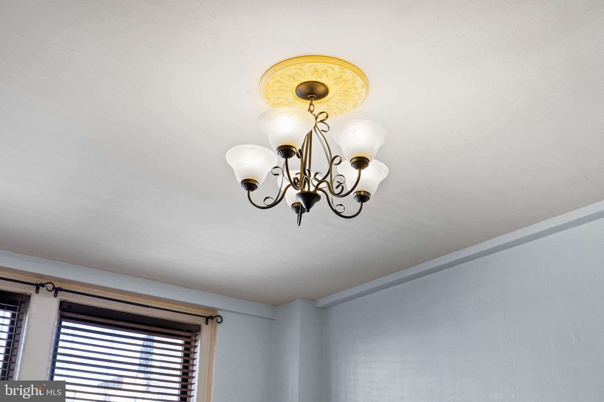 1324 Locust Street, Unit 807 Philadelphia, PA 19107 - Photo 21 of 36 a view of a chandelier fan and a window