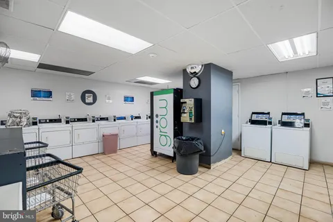 a kitchen with a sink and white cabinets
