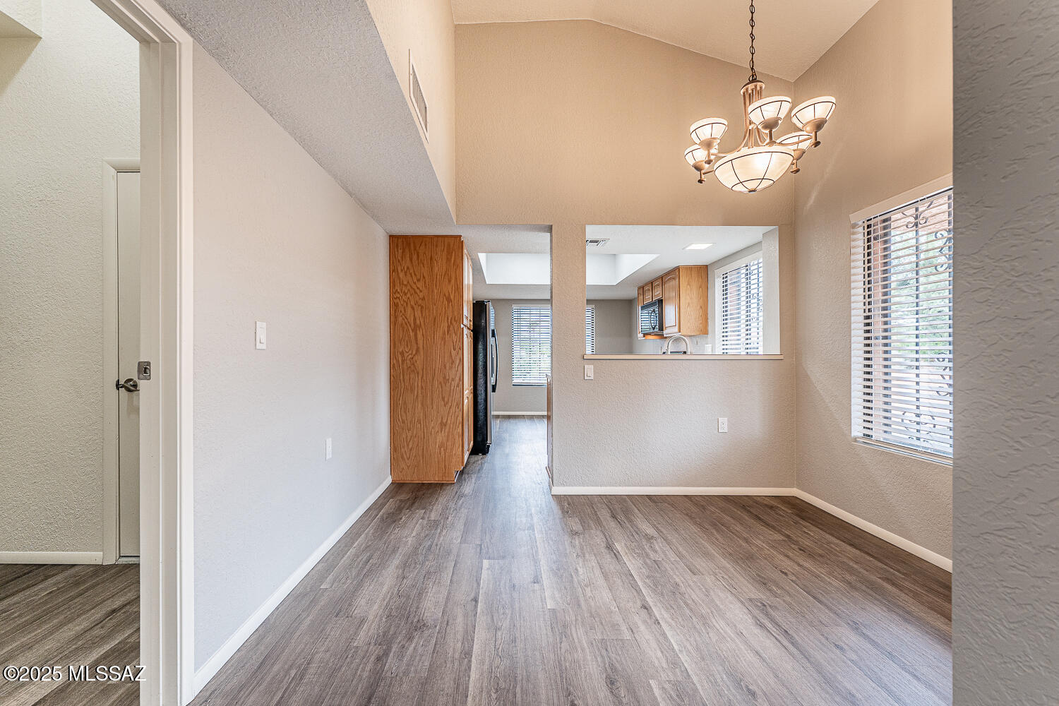 931 West Rio Guaymas Green Valley, AZ 85614 - Photo 13 of 39 wooden floor in an empty room with a window