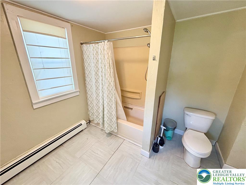 7241 Decatur Street New Tripoli, PA 18066 - Photo 23 of 36 Functional full bathroom featuring a tub with shower and ample natural light.