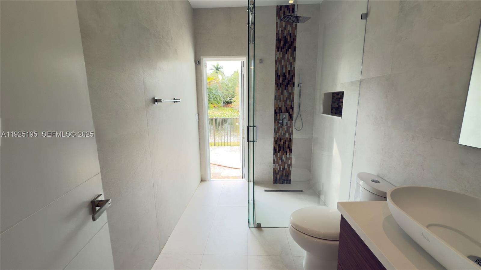 3763 Oak Ridge Circle Weston, FL 33331 - Photo 12 of 33 a bathroom with a toilet and a shower