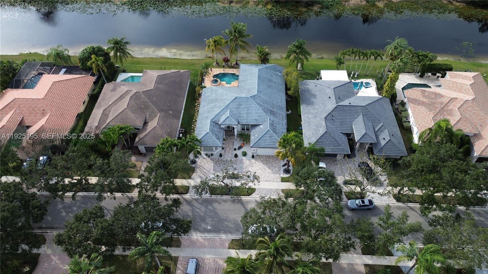 3763 Oak Ridge Circle Weston, FL 33331 - Photo 2 of 33 an aerial view of houses with outdoor space