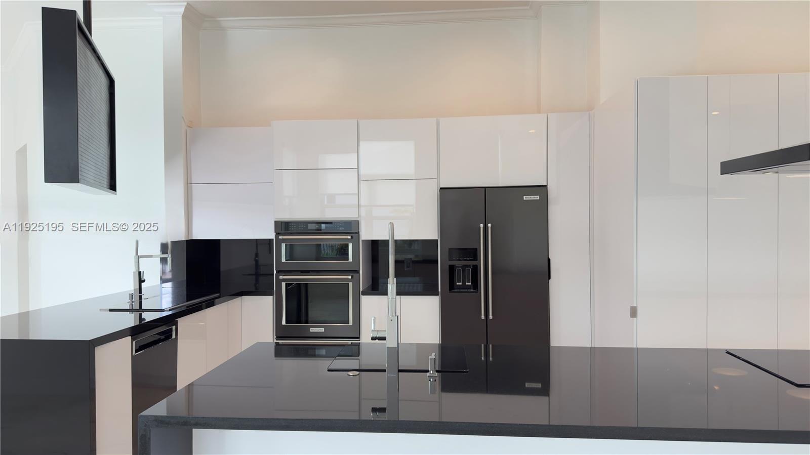 3763 Oak Ridge Circle Weston, FL 33331 - Photo 27 of 33 a kitchen with stainless steel appliances a refrigerator and a stove top oven