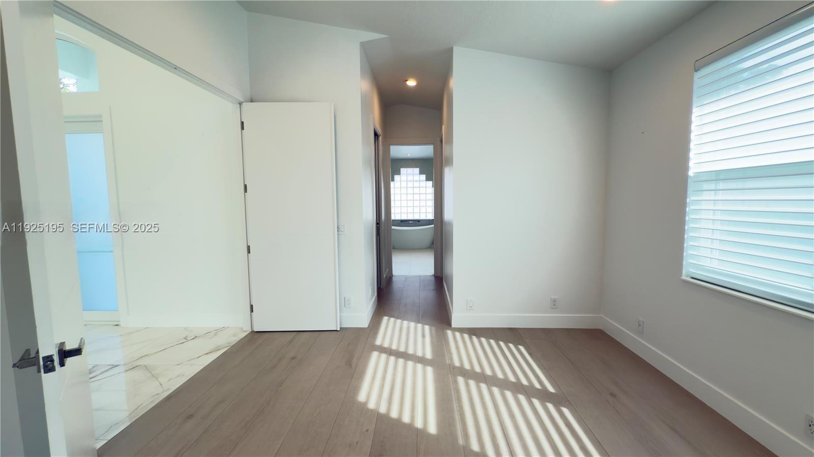 3763 Oak Ridge Circle Weston, FL 33331 - Photo 29 of 33 a view of a room with wooden floor and windows