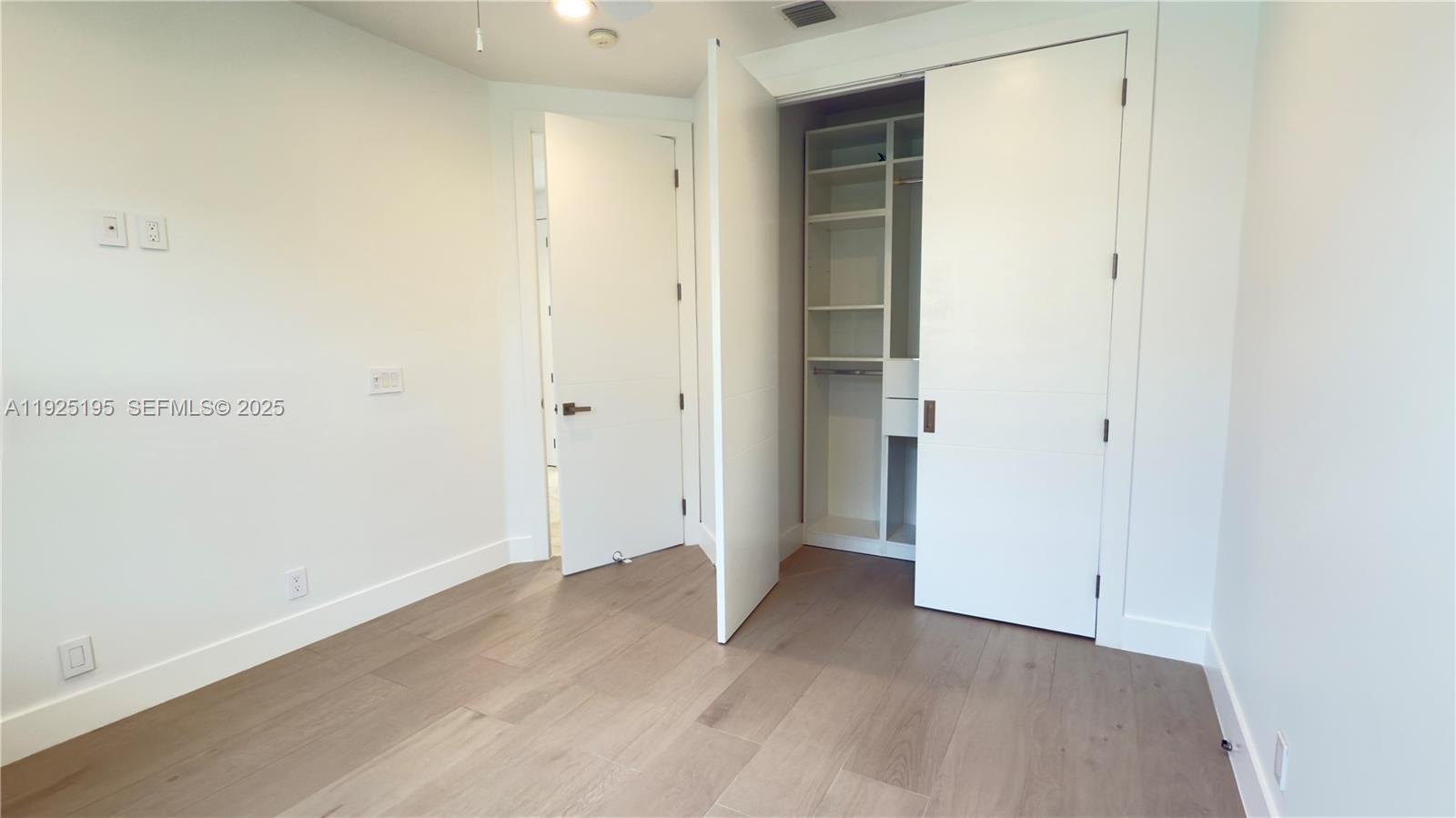 3763 Oak Ridge Circle Weston, FL 33331 - Photo 5 of 33 an empty room with wooden floor