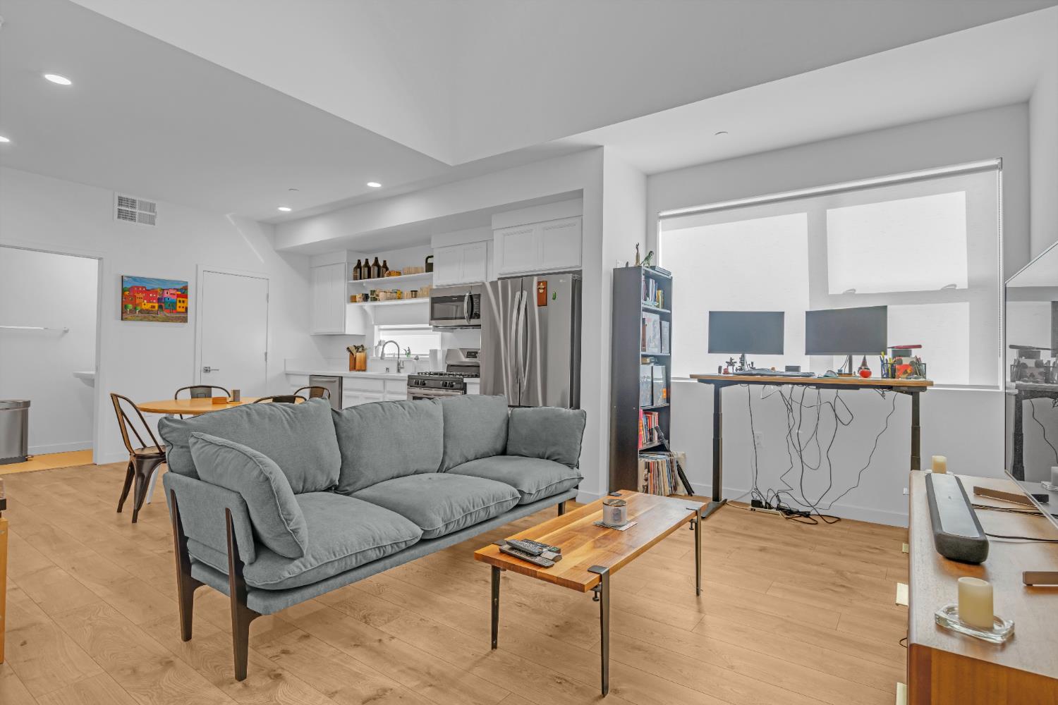 2431 Cleat Lane, Unit 301 Sacramento, CA 95818 - Photo 12 of 18 a living room with furniture and a table