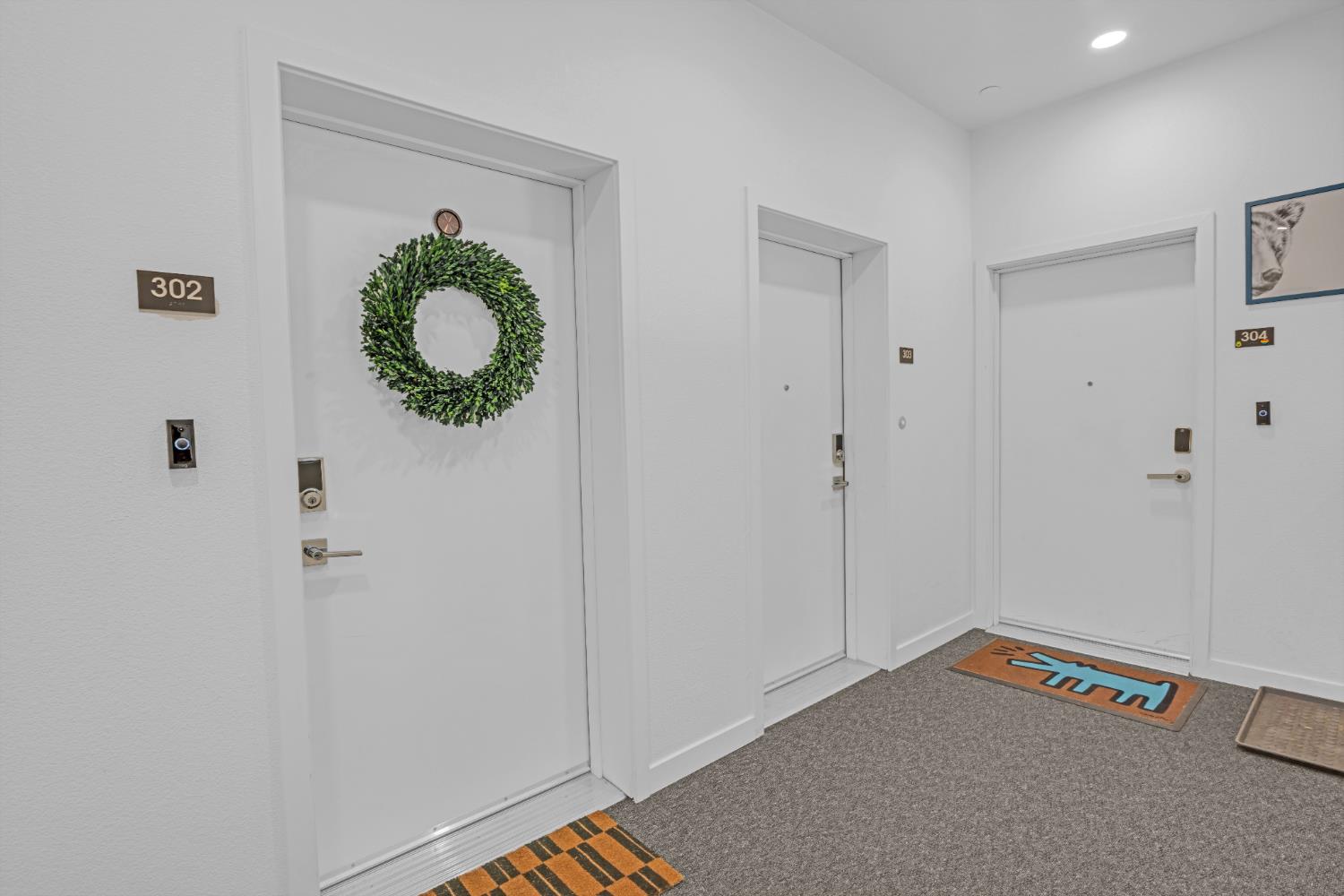 2431 Cleat Lane, Unit 301 Sacramento, CA 95818 - Photo 2 of 18 a view of an entryway with wooden floor