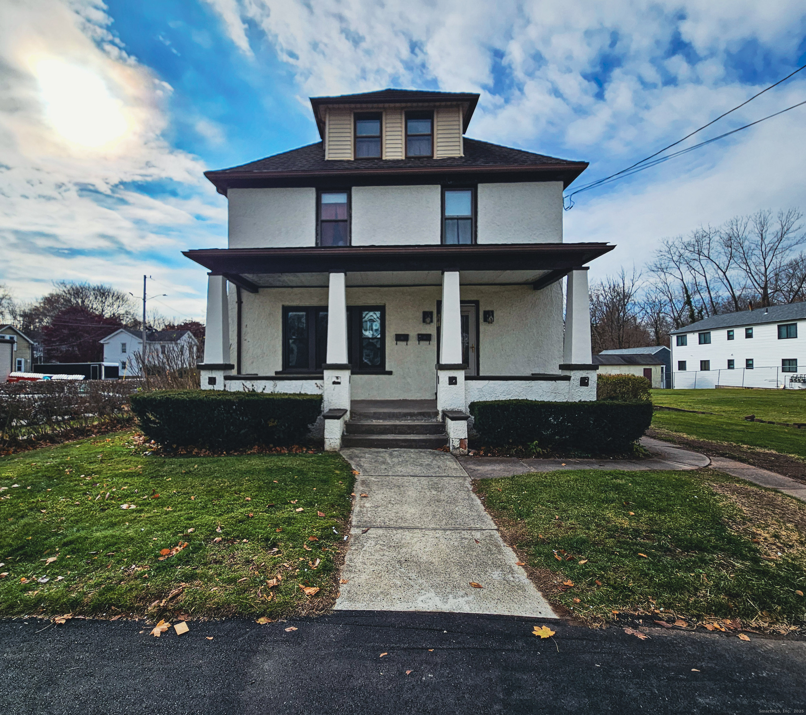 a front view of a house with garden