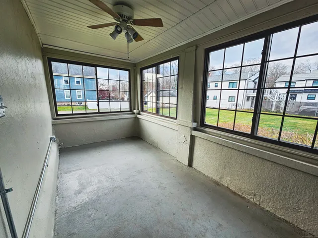 a view of an empty room with a window