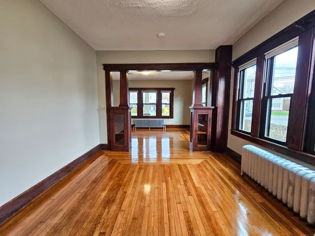 wooden floor in a hall with an entryway