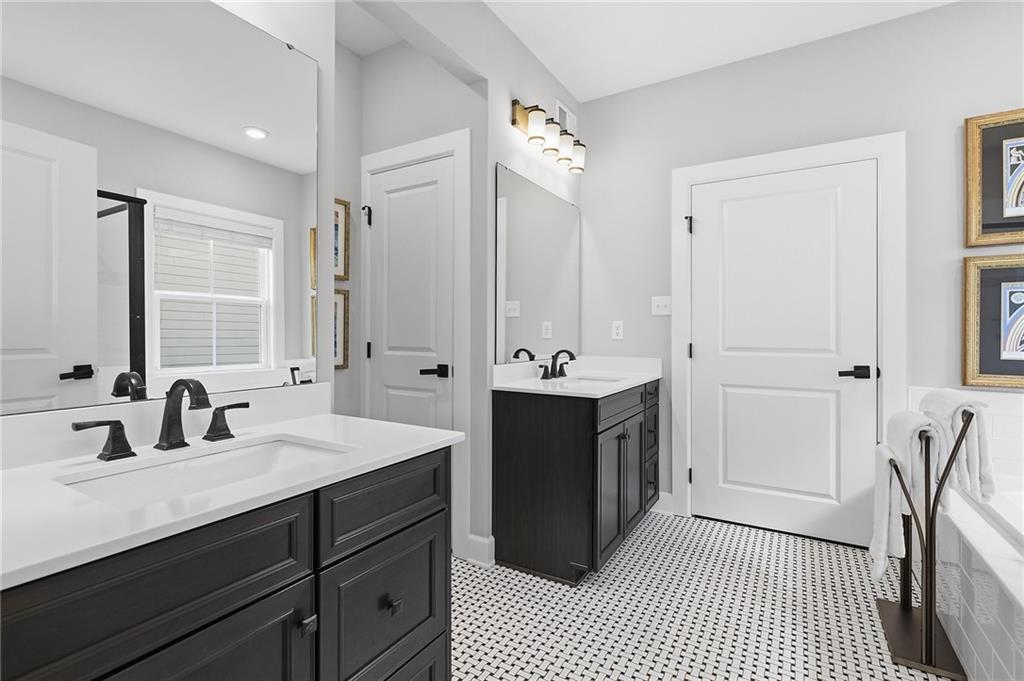 2015 Cherry Road Gibsonia, PA 15044 - Photo 23 of 50 a bathroom with a double vanity sink a mirror and a shower