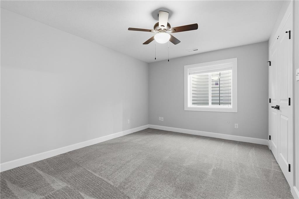 2015 Cherry Road Gibsonia, PA 15044 - Photo 40 of 50 an empty room with a window and a ceiling fan
