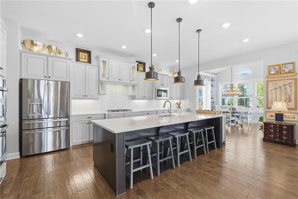 2015 Cherry Road Gibsonia, PA 15044 - Photo 10 of 50 a kitchen with stainless steel appliances granite countertop a table chairs stove and kitchen island