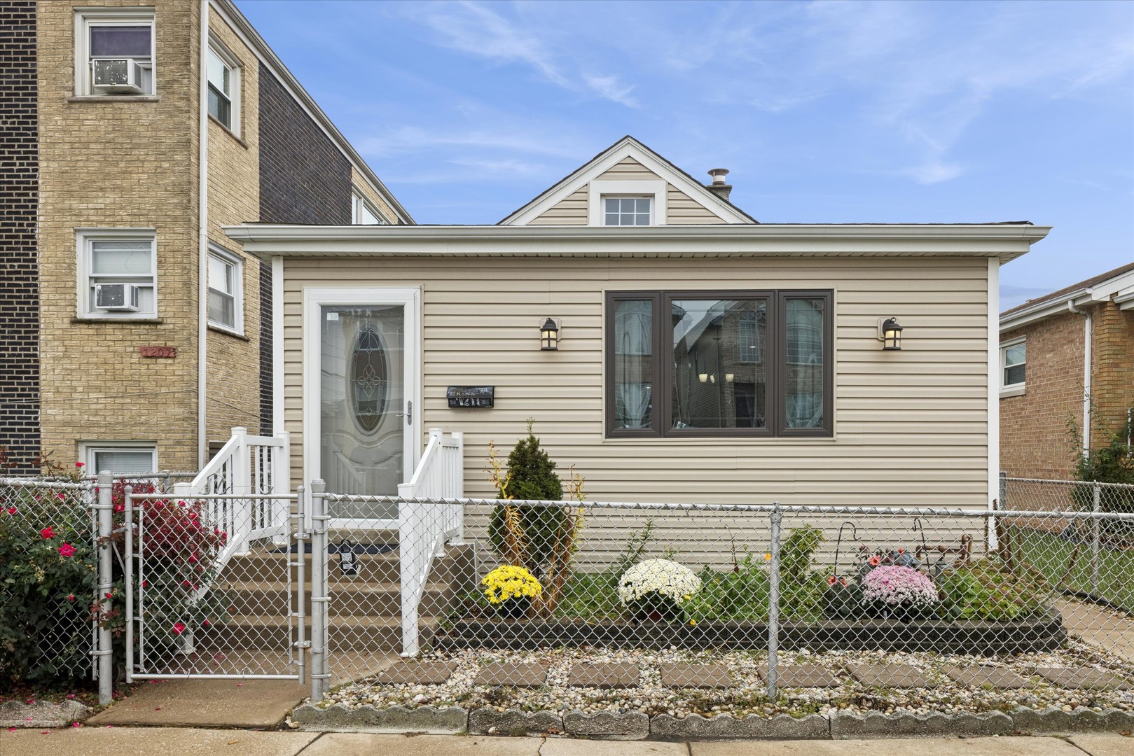 a front view of a house with garden