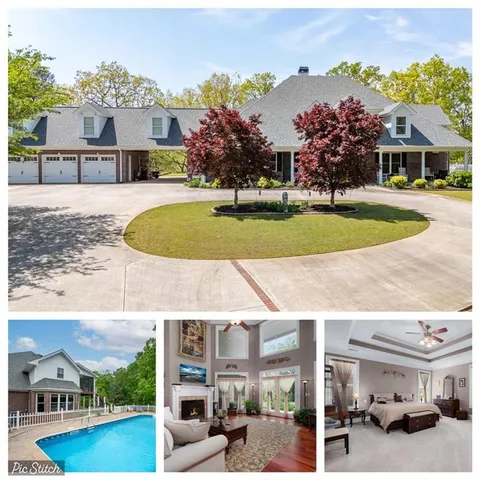 a view of a house with swimming pool and a yard