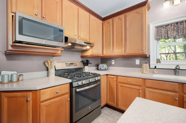 a bathroom with double vanity sinks and a mirror