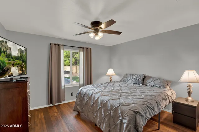 a bedroom with a bed and a lamp