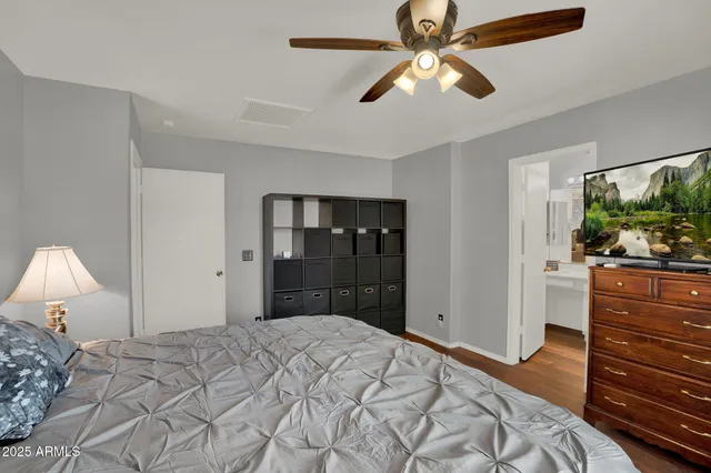 a bathroom with a sink vanity mirror and toilet