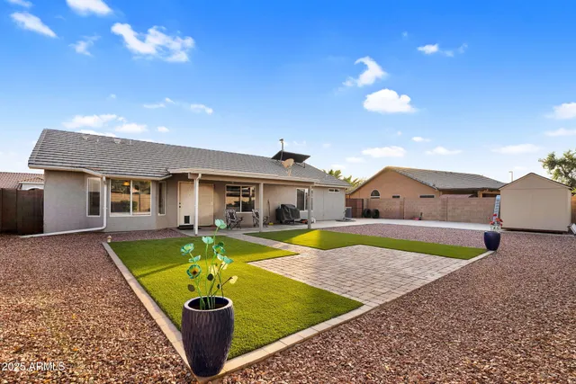a front view of house with yard and entertaining space