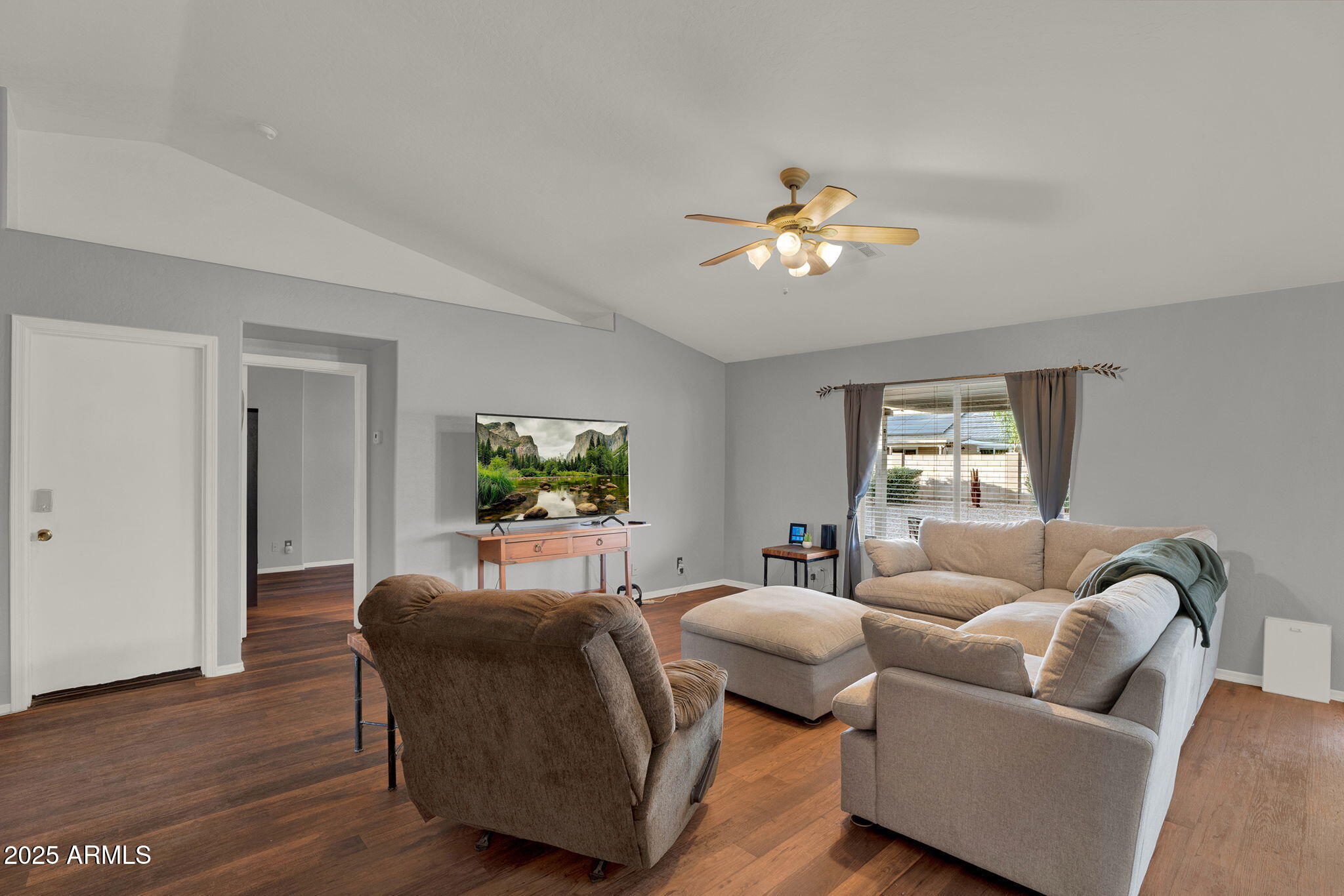 3058 East Erie Street Gilbert, AZ 85295 - Photo 5 of 36 a living room with furniture and a flat screen tv